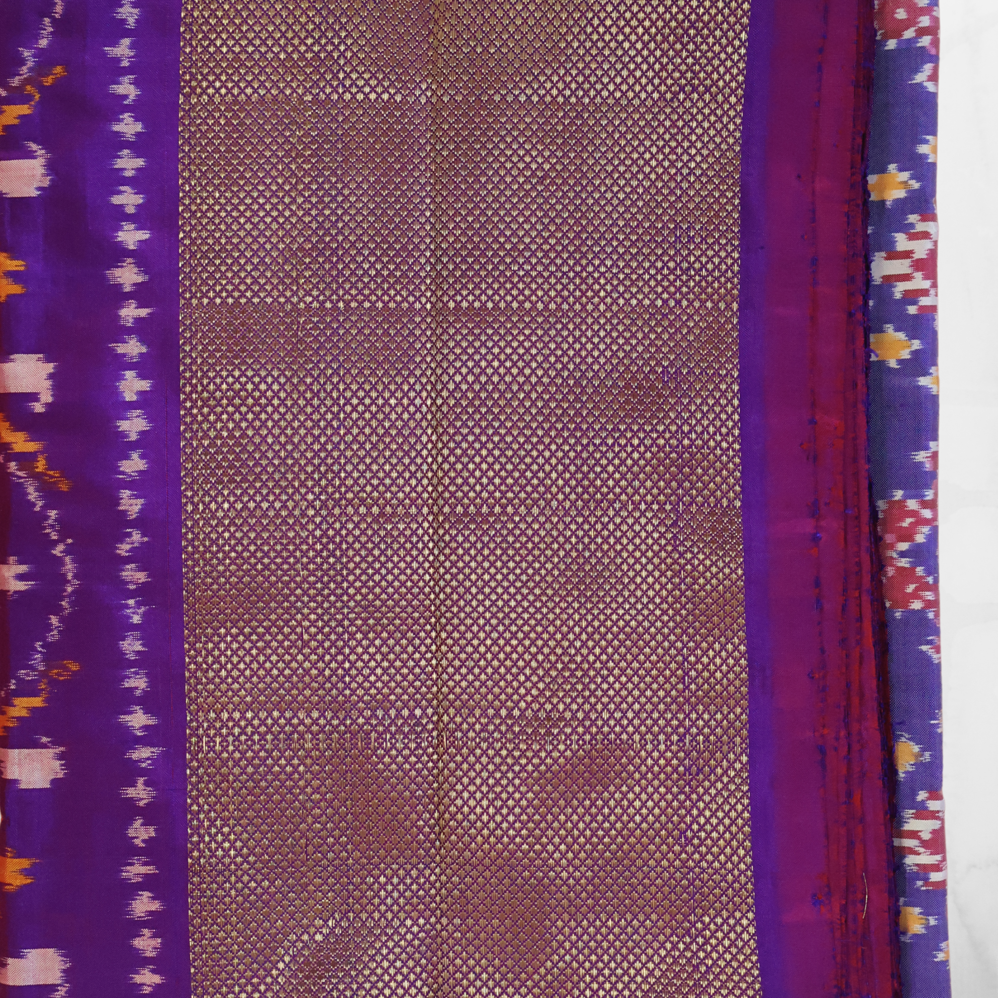 Pure Silk Pochampally Ikat Saree in Mauve with Purple Chatai Border