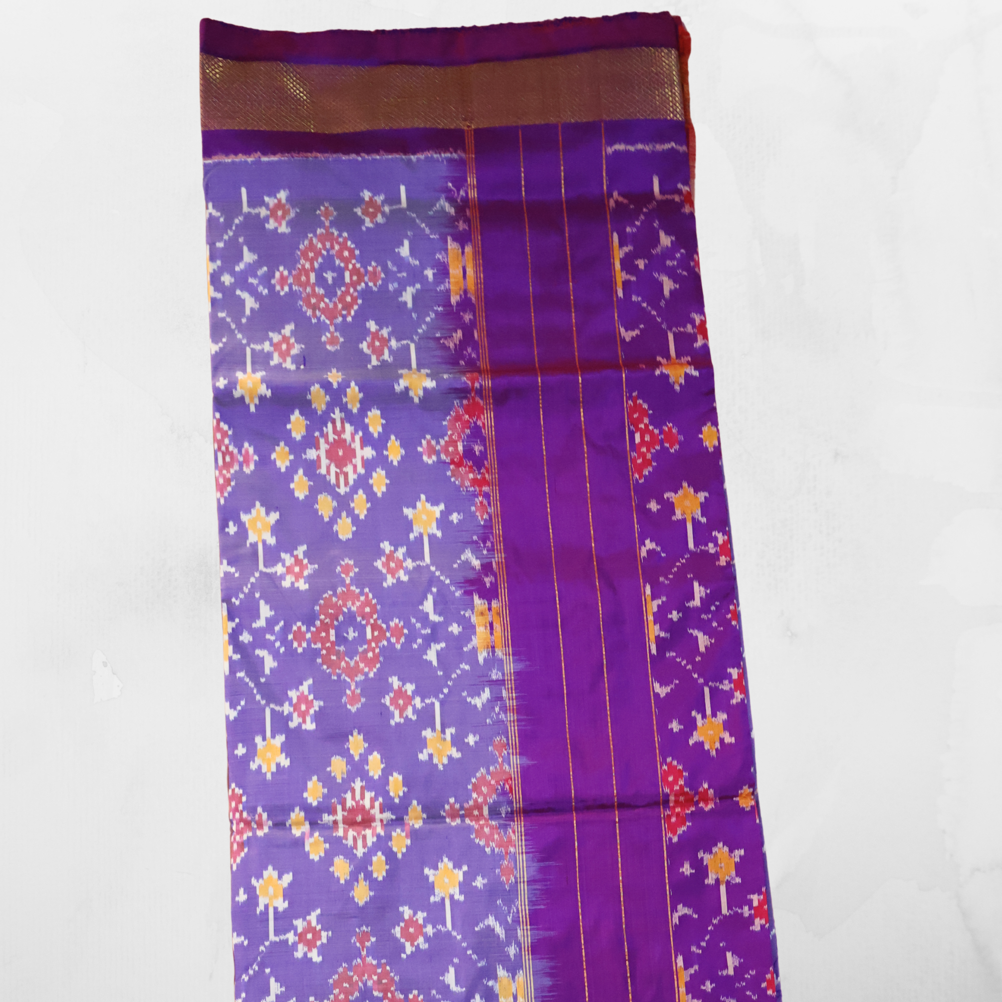 Pure Silk Pochampally Ikat Saree in Mauve with Purple Chatai Border