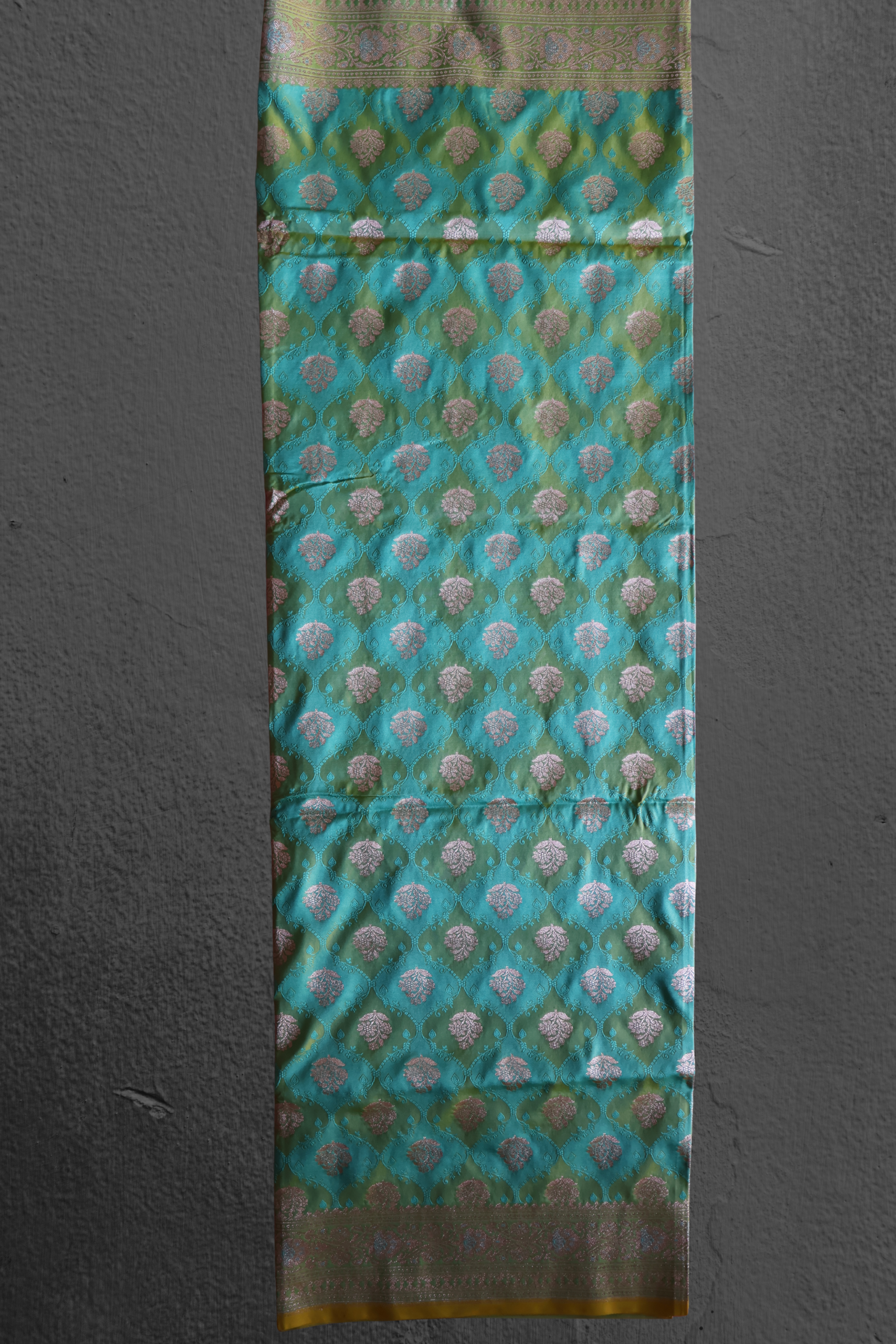 Katan Silk Banarasi Saree in Teal Green with Silver Zari Buta and Ornate Border